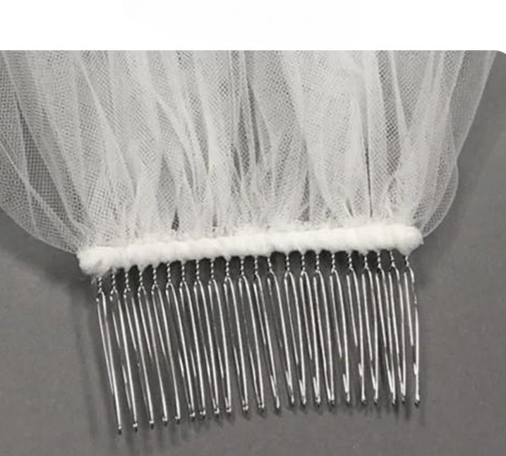 Two-layer pearl beaded bridal veil with Korean style metal hair comb on soft chiffon tulle background
