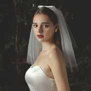 Ivory bridal veil and headpiece set in light white chiffon tulle for weddings