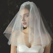 Ivory bridal veil and headpiece set in light white chiffon tulle for weddings