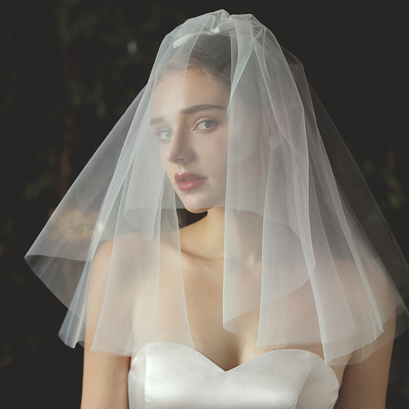Ivory bridal veil and headpiece set in light white chiffon tulle for weddings