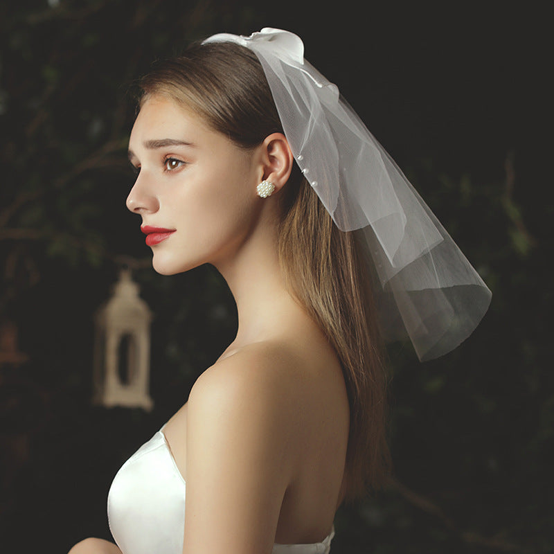 Pearl beaded bow bridal veil made of soft chiffon tulle, lightweight and sheer wedding headpiece