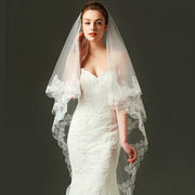 Ivory lace bridal veil with ethereal bow-accent cathedral tulle design on soft chiffon fabric