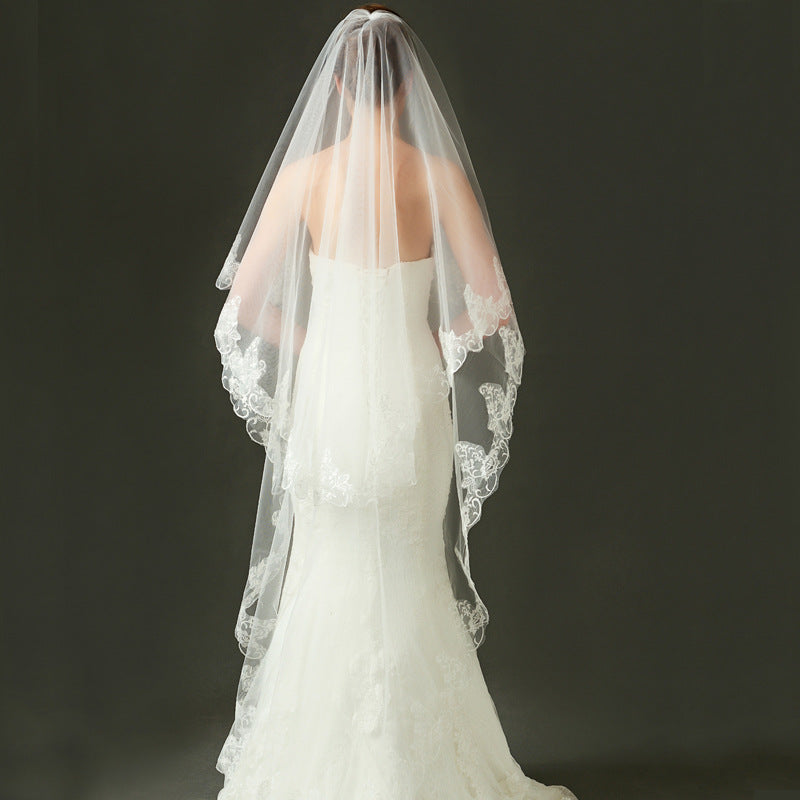 Ivory lace bridal veil with ethereal bow-accent and cathedral tulle in soft chiffon for elegant weddings