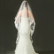 Ivory lace bridal veil with ethereal bow-accent and cathedral tulle in soft chiffon for elegant weddings