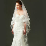 Ivory lace bridal veil with ethereal bow-accent and cathedral tulle design on soft chiffon fabric