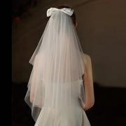 Double-layer mid-length bridal veil with satin ribbon bow and soft chiffon tulle