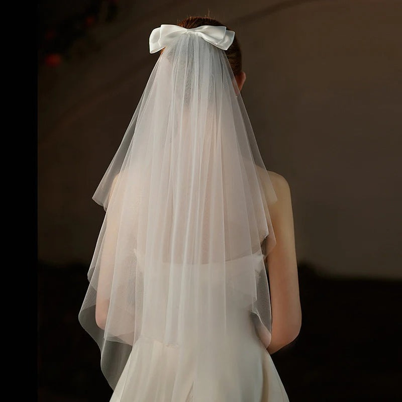 Double-layer mid-length bridal veil with satin ribbon bow and soft chiffon tulle