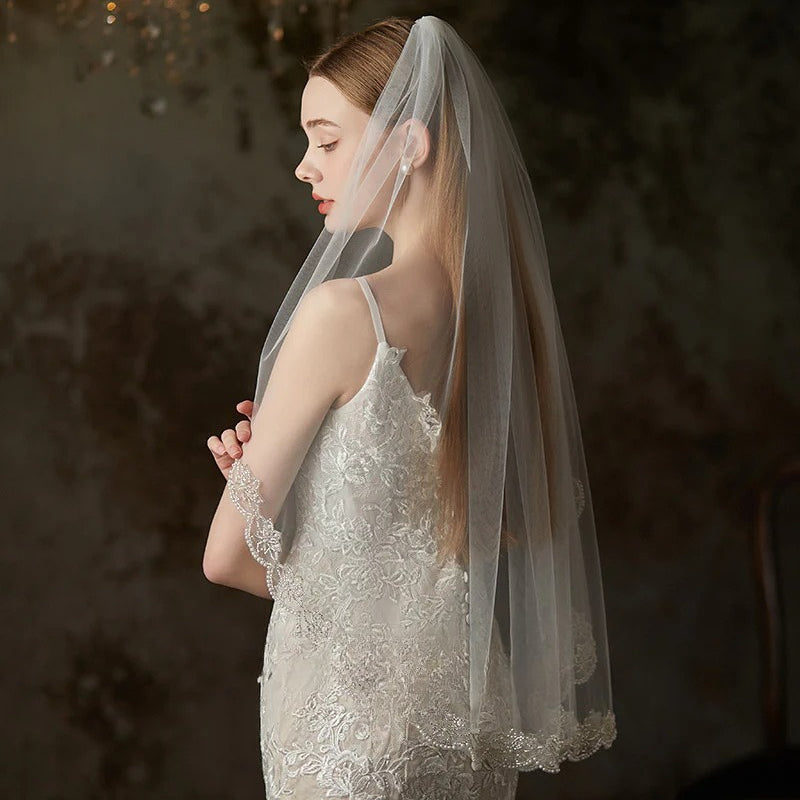 Embroidered soft tulle bridal veil in pure white with fairy forest style mid-long design