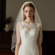 Handcrafted beaded hair comb with mid-length tulle bridal veil, elegant and lightweight wedding headpiece