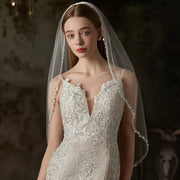 Handmade bridal veil with beaded metal comb on soft chiffon tulle