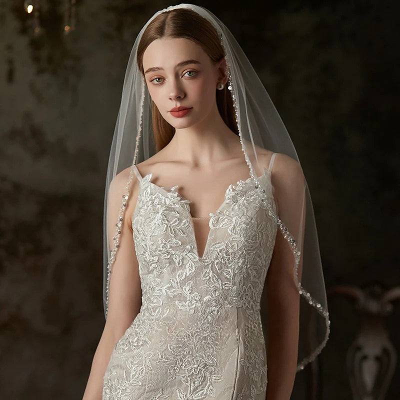 Handmade bridal veil with beaded metal comb on soft chiffon tulle