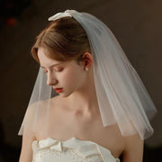 Ivory Bow Bridal Veil made of soft chiffon tulle with elegant knot accent for weddings