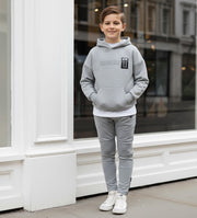Boys slim fit gray stretch knit pants for ages 4-12 with elastic waistband and tapered leg