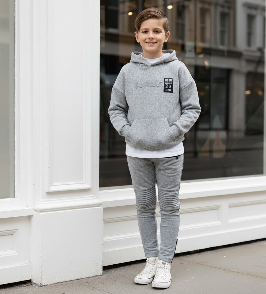 Boys slim fit gray stretch knit pants for ages 4-12 with elastic waistband and tapered leg