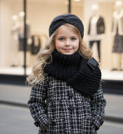 Toddler girl wearing elegant red cashmere long coat with black bow detail for autumn winter.