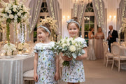 Toddler wearing elegant girls floral princess dress with removable sleeves at a birthday party
