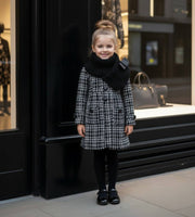 Young girl wearing elegant red cashmere long coat with black bow, autumn winter wear for ages 3-5 years