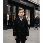 Boy wearing military style wool jacket with double-breasted buttons and smart tailoring
