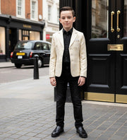 Young boy wearing a tailored boys gold jacquard blazer for formal events aged 8-12