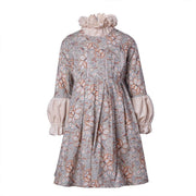 Girl wearing floral vintage A-line dress for special occasions and weddings