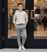 Boys slim fit gray stretch knit pants for ages 4-12 with elastic waistband and tapered leg