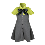 Girl wearing elegant apple green cape flower girl dress with black bow