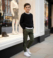 Boys slim fit gray stretch knit pants for ages 4-12 years with elastic waistband and tapered leg