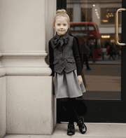 Girls vintage wool waistcoat with bow detail for elegant layering at weddings and parties