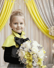 Apple green cape flower girl dress with black bow and button-front detail for girls aged 9-12