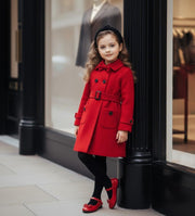 Girls wearing elegant red cashmere long coats with black bow detail for autumn winter ages 3-5 years