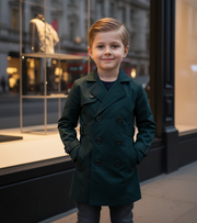 Kids Double Breasted Trench Coat in dark teal, smooth fabric with a classic lapel, double-button front and belted cuffs.