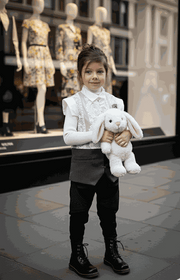Girl wearing vintage lace vest sleeveless long cardigan layered over white dress