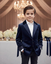 Boy wearing a tailored navy velvet blazer with classic lapels for formal and everyday occasions