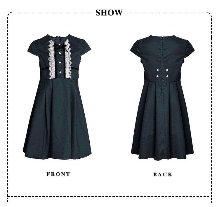 Girl wearing dark green lace dress with white lace accents, vintage cotton A-line style for ages 3-7