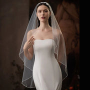 Single-layer beaded lace bridal veil in soft white and beige chiffon tulle, lightweight and elegant wedding accessory