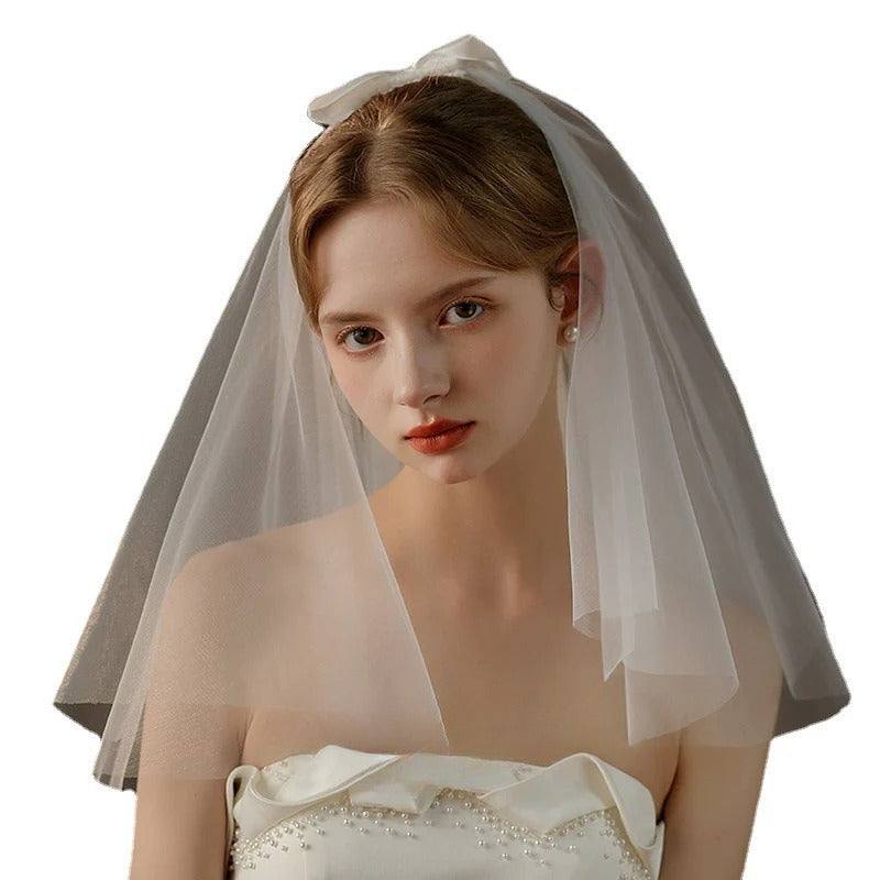 Ivory Bow Bridal Veil crafted from soft chiffon tulle with elegant knot accent for timeless wedding elegance