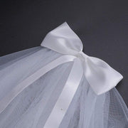 Ivory Bow Bridal Veil in soft chiffon tulle with elegant knot detail, lightweight and sheer wedding headpiece