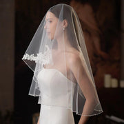 Single-layer beaded lace bridal veil in soft white and beige, lightweight chiffon tulle, elegant and sheer wedding accessory