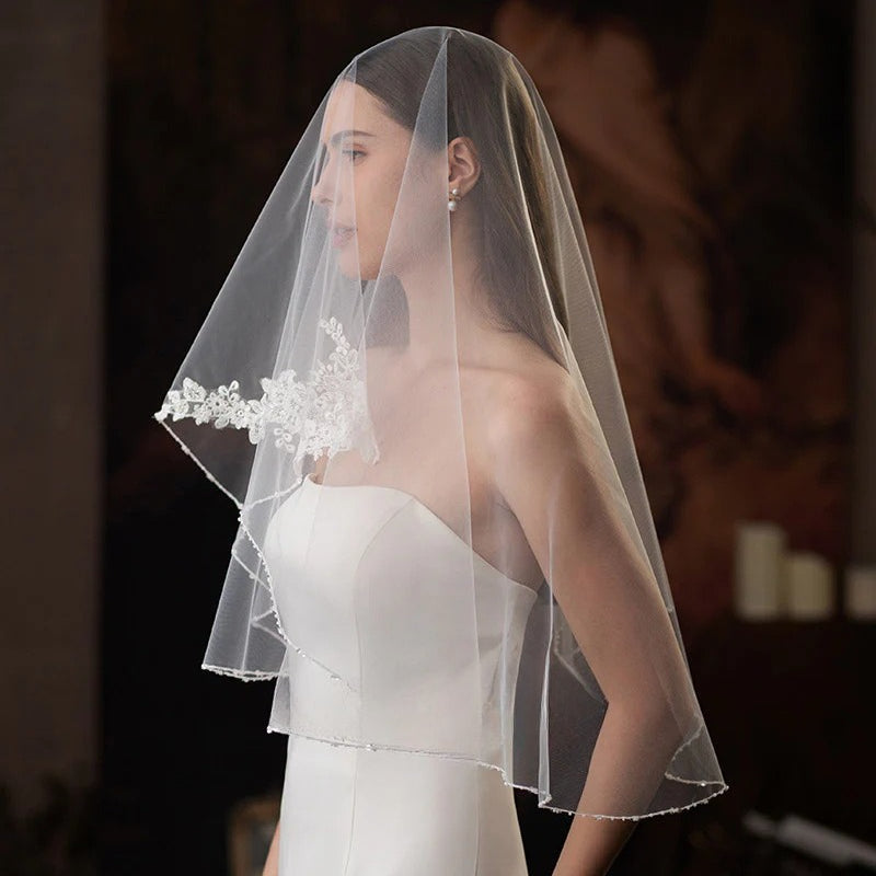 Single-layer beaded lace bridal veil in soft white and beige, lightweight chiffon tulle, elegant and sheer wedding accessory
