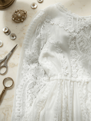Girls long white lace fairy dress with delicate floral lace and flowing skirt for special occasions