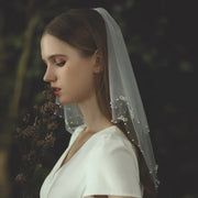 Double-layer Korean bow bridal veil with beaded tulle and metal comb, lightweight and elegant wedding headpiece