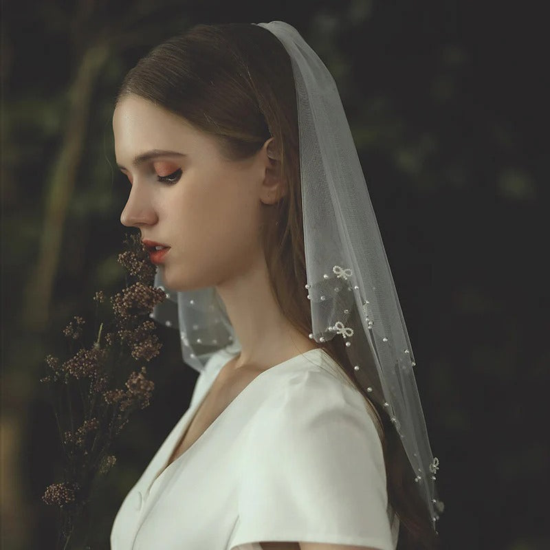 Double-layer Korean bow bridal veil with beaded tulle and metal comb, lightweight and elegant wedding headpiece