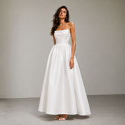 Elegant satin strapless wedding dress with sculpted bodice and full skirt in minimalist bridal design