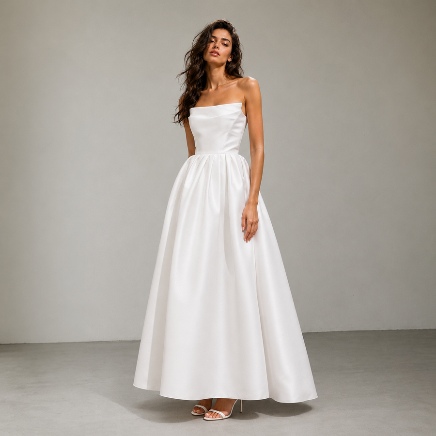Elegant satin strapless wedding dress with sculpted bodice and full skirt in minimalist bridal design