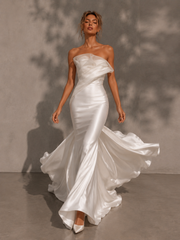 Ivory sculpted satin mermaid wedding guest dress with organza folded bust and floor-sweeping train