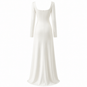 Ivory satin wedding guest dress with floral appliqué and long sleeves