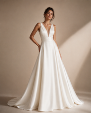Ivory satin deep V-back wedding guest dress with elegant waist pleating and flowing skirt