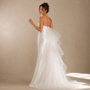 Ivory pearl satin wedding dress with sculpted floral appliqué and detachable tulle train