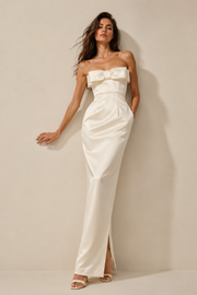 Ivory satin strapless evening gown with sculpted neckline and elegant bow detail