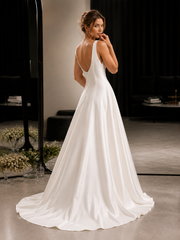 Elegant satin backless wedding dress with minimalist open back and flowing train
